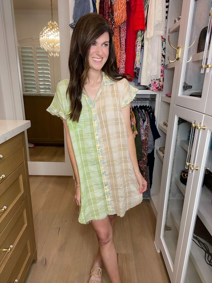 An everyday dress that's perfect with sneakers or sandals? We're in! This easy-to-wear button front dress is a no-brainer for summer. The lightweight fabric works on the hottest of days and the combo of spring green, yellow, and taupe is such a fun color palette. You can style this as a dress or, if you're taller, style it like a tunic. This silhouette is a customer fave every year so we're so excited to have it in a fresh new print! This is not lined. We do not feel like you need anything extra besides nude undergarments but you can always add a slip for extra coverage. Dress measures 33" in length the front (which we would consider a little flirty) and 37" in the back. Bust measures from underarm seam to seam. Measurements taken on a small. Add 1" to each measurement as you go up in size Green Casual Mini Dress For Vacation, Summer Vacation Button-up Shirt Dress, Trendy Summer Shirt Dress For The Beach, Trendy Shirt Dress For Beach And Summer, Button-up Shirt Dress For Summer Vacation, Summer Button-up Relaxed Fit Shirt Dress, Summer Cotton Button-up Shirt Dress, Trendy Shirt Dress For Summer Beach, Summer Relaxed Fit Button-up Shirt Dress