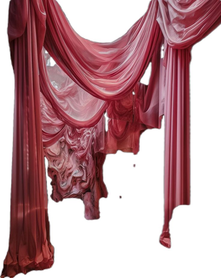 the canopy is covered with red fabric and draping to create an artistic backdrop