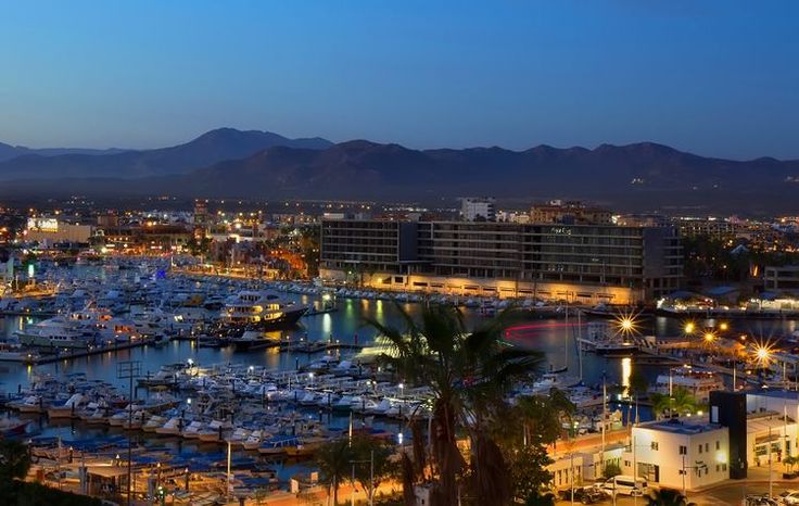 a harbor filled with lots of boats at night