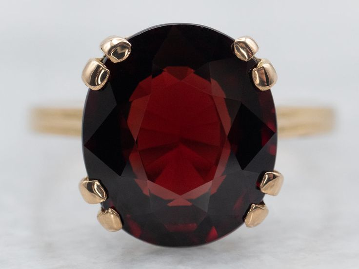 This beautiful yellow gold solitaire ring showcases a single garnet gemstone. Its timeless design and quality craftsmanship lasts for generations, providing you with a timeless piece of jewelry for decades to come.Metal: 18K Yellow GoldGem: Garnet 5.11 CaratsGem Measurements: 9.9 x 11.3 mm, OvalRing Size: 6.50 Formal Garnet Ring With Center Stone, Formal Garnet Birthstone Ring In Fine Jewelry Style, Formal Garnet Birthstone Ring Fine Jewelry, Formal Garnet Birthstone Ring, Classic Yellow Gold Garnet Rings, Classic Yellow Gold Garnet Birthstone Ring, Classic Garnet Birthstone Ring In Yellow Gold, Formal Solitaire Ruby Ring In Yellow Gold, Formal Yellow Gold Ruby Solitaire Ring