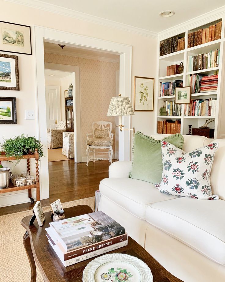 a living room filled with furniture and bookshelves