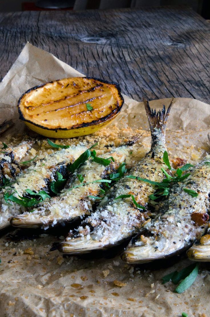 grilled fish with parmesan cheese and herbs