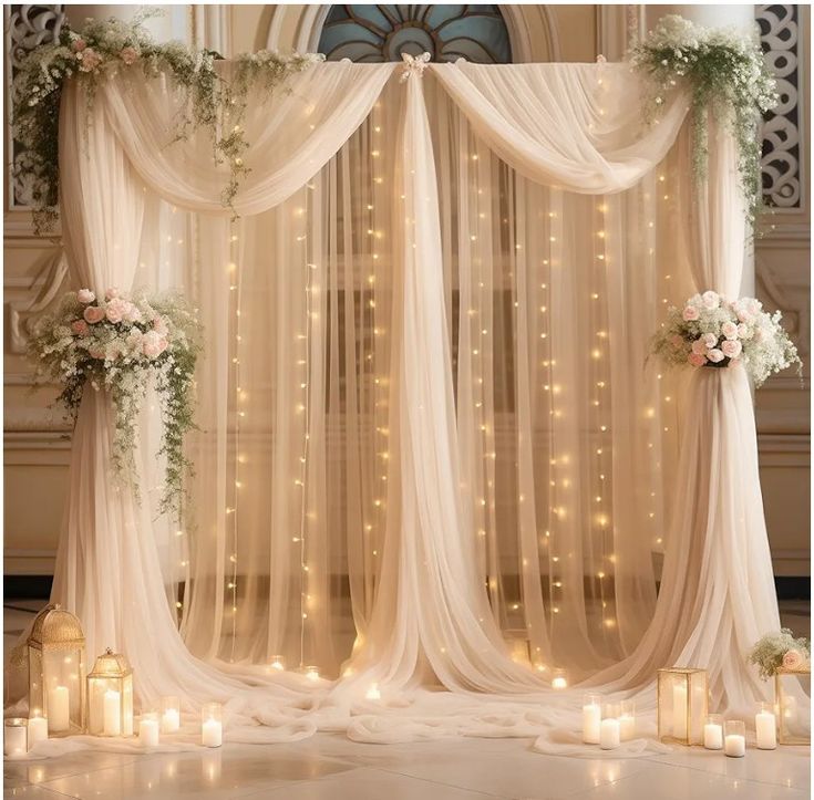 an image of a wedding stage set up with candles and flowers on the side wall