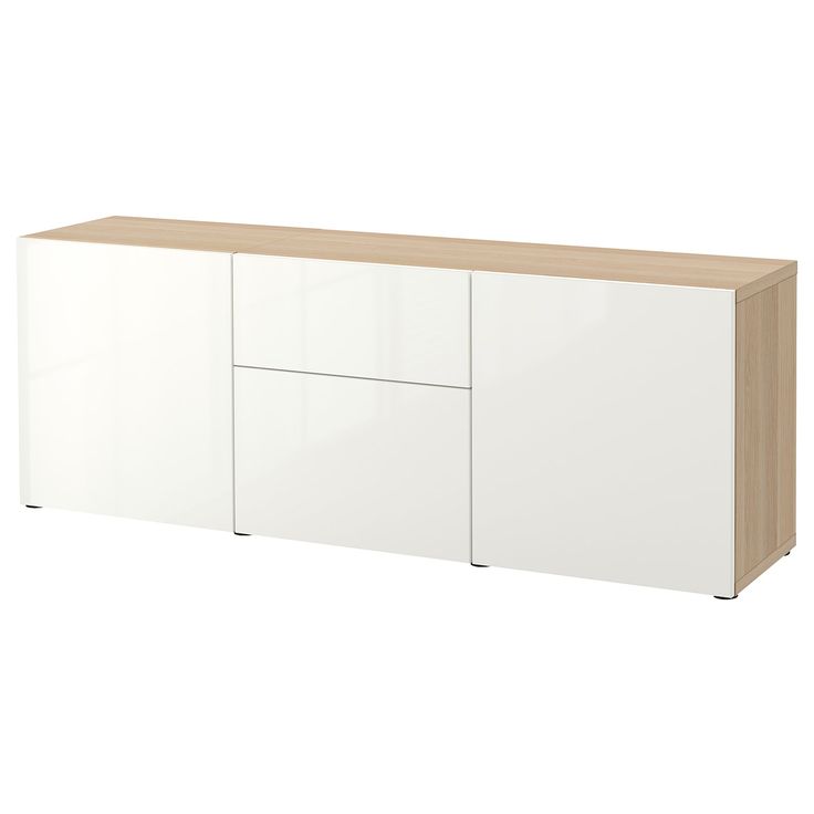 the sideboard is white and has two doors on one side, and three drawers on the other