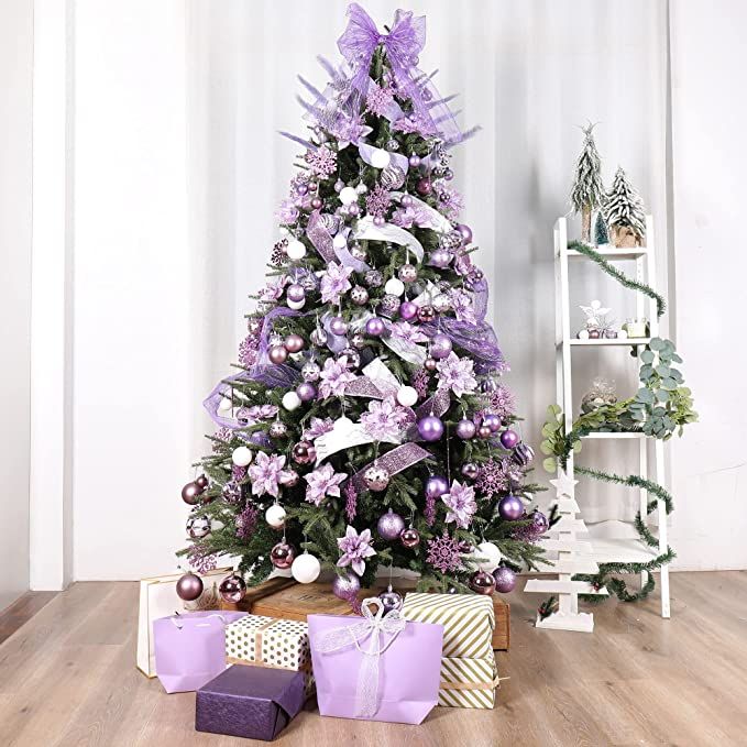 a purple christmas tree with presents under it