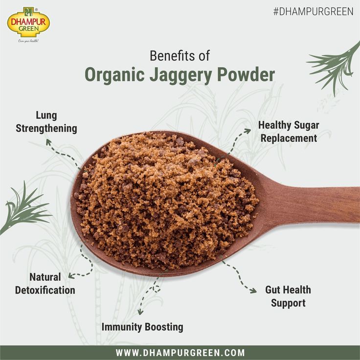 a wooden spoon filled with organic jagery powder and labeled in the words, benefits of organic jagery powder