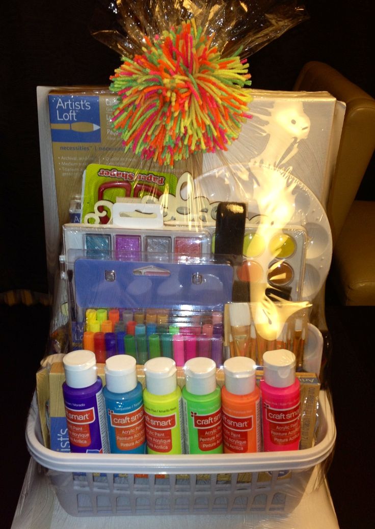 an assortment of crafting supplies in a plastic container