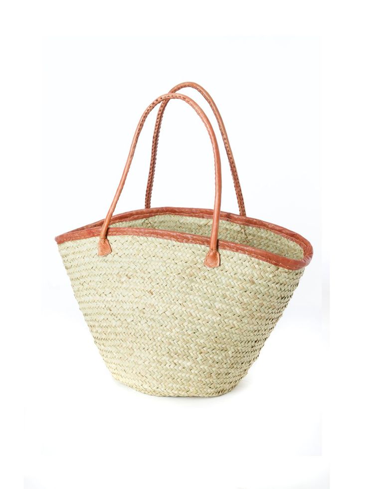 Kenyan artisans expertly weave thinner strips of palm leaves to create this stylish open top tote bag. This indispensable palm fiber tote offers a more refined weave than other palm shoppers. A leather trimmed top and handles add style and durability. A lovely handwoven fair trade basket from Africa, so darling that you and your little one may want to get matching baskets. Woven Leather Beach Bag For Shopping, Woven Leather Basket Straw Bag For Market, Eco-friendly Palm Leaf Beach Bag With Leather Handles, Market Woven Leather Straw Tote Bag, Natural Fiber Straw Bag With Rolled Handles For Shopping, Natural Woven Leather Straw Bag For Shopping, Woven Leather Straw Bag For Shopping, Palm Leaf Basket Bag For Shopping, Natural Straw Basket Bag With Rolled Handles