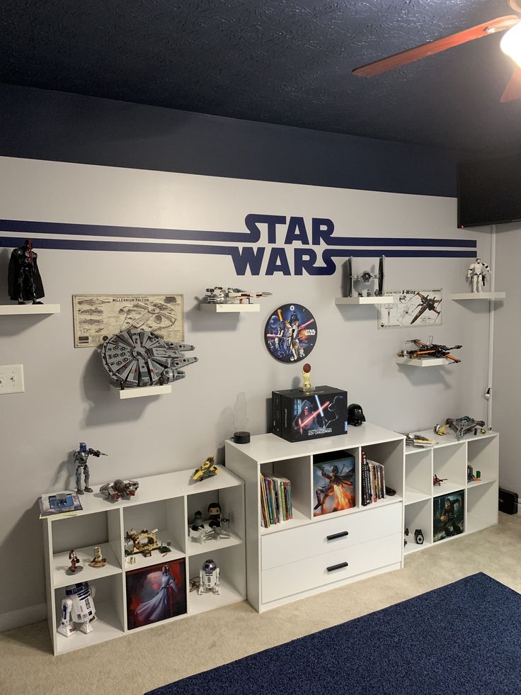 a star wars themed room with shelves and toys