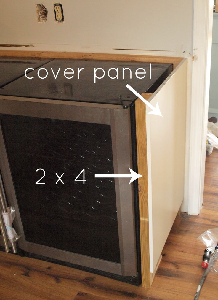 an oven is shown with the cover panel and 2x4 feet above it,