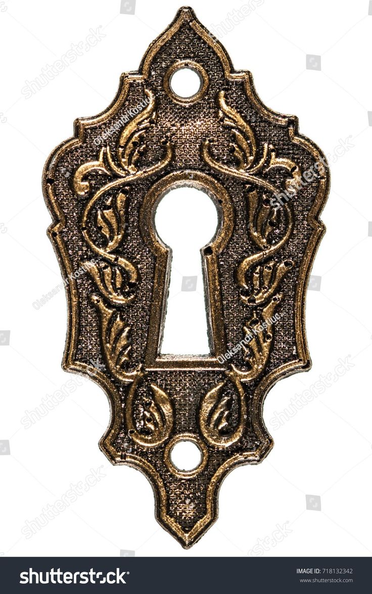 an antique keyhole with ornate design on white background