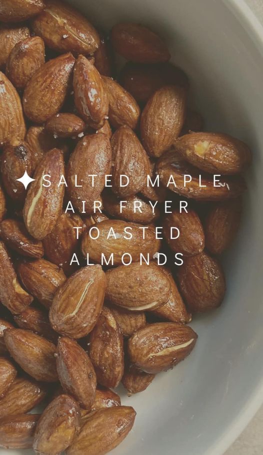 salted maple air fryer toasted almonds in a white bowl with the words salted maple air fryer toasted almonds