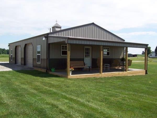 a house with a covered patio in the middle of a grassy area next to a field