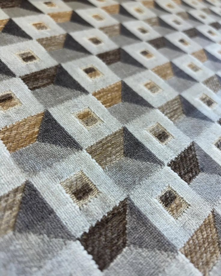 a close up view of a rug with squares and rectangles