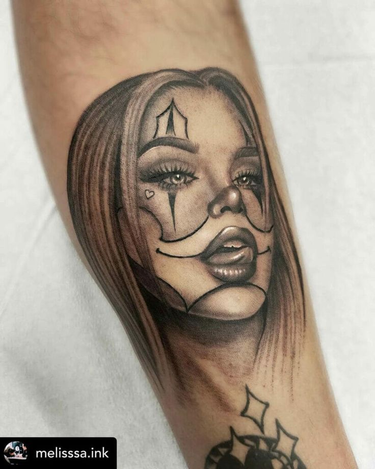 a woman's face with makeup on her arm