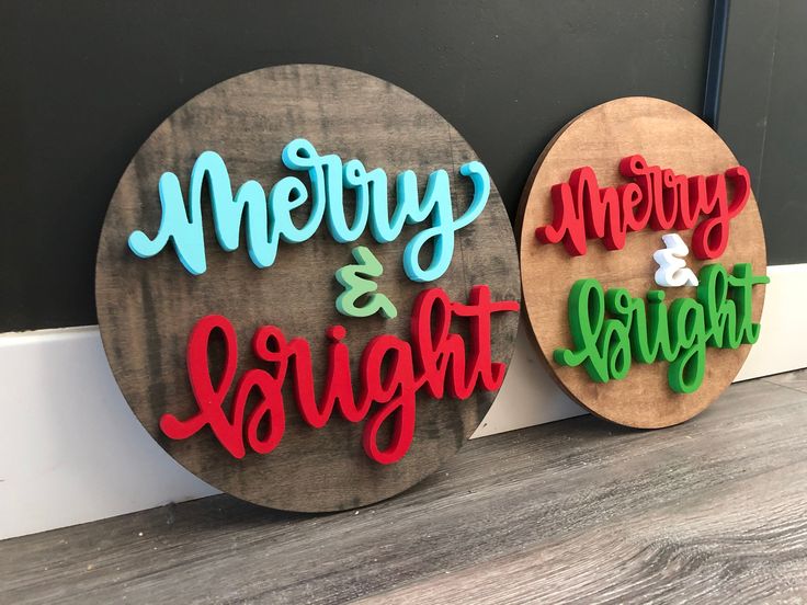 two wooden signs that say merry and bright