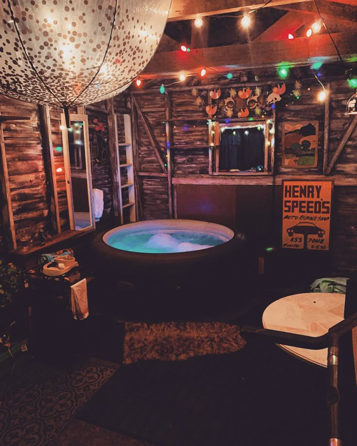 an indoor hot tub surrounded by lights and decorations