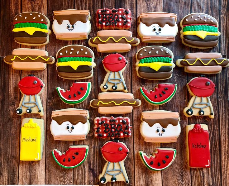 decorated cookies arranged in the shape of hamburgers, watermelon and hot dogs