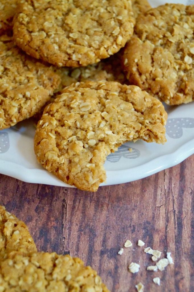 oatmeal cookies on a plate with one broken in half