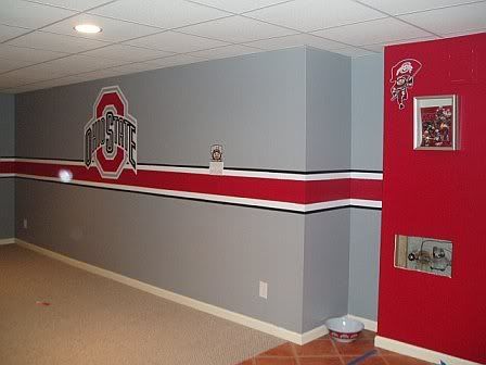 an empty room with red and gray walls