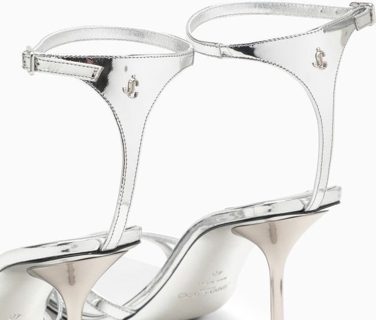 Elevate your summer wardrobe with these stunning metallic silver leather sandals. The squared open toe and tapered heel add a modern edge to this timeless design, while the adjustable ankle strap with buckle fastening ensures the perfect fit. Complete with a back logo and a luxurious leather sole, these sandals are a must-have for anyone who appreciates high-end, designer footwear. Metallic silver-coloured leather Squared open toe Tapered heel Adjustable ankle strap with buckle fastening Back lo Sandal For Women, Magazine Vogue, Leather Sandals Women, Leather Cap, Colored Leather, Metallic Leather, Leather Jewelry, Lanvin, Mens Shoes Sneakers