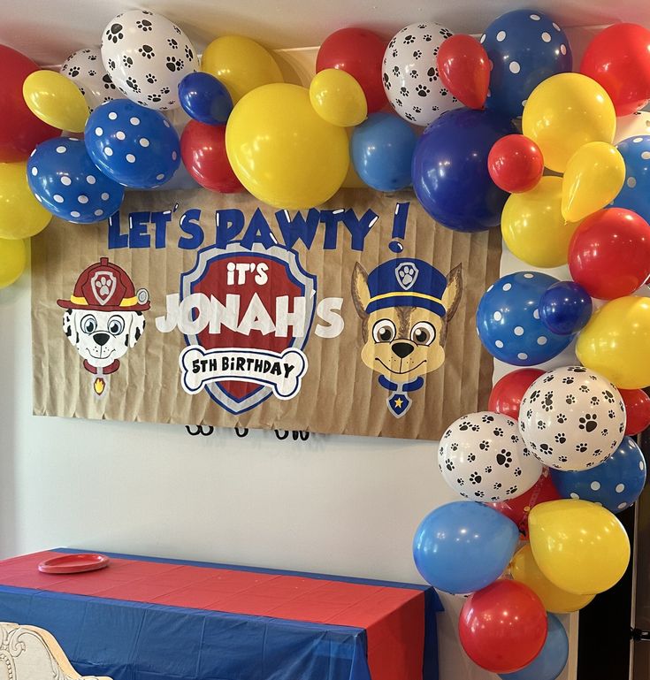 this is a birthday party with balloons and decorations