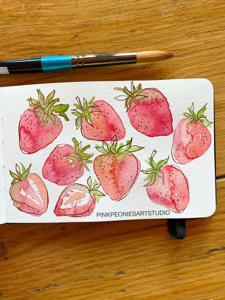 a drawing of strawberries on a piece of paper