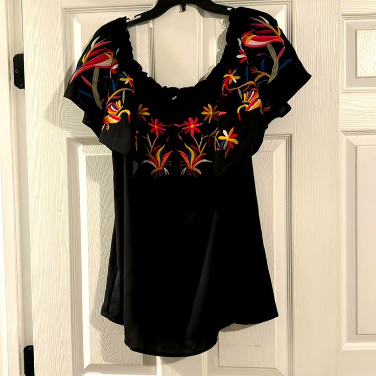 Entro 2x Black Off Shoulder Spanish Style Blouse With Embroidered Bird And Flower Pattern Casual Black Embroidered Top For Spring, Embroidered Black Blouse For Beach, Black Embroidered Short Sleeve Top For Spring, Casual Black Embroidered Top With Short Sleeves, Black Floral Embroidered Blouse For The Beach, Casual Fitted Black Embroidered Top, Casual Black Blouse With Floral Embroidery, Black Short Sleeve Embroidered Casual Top, Black Short Sleeve Tops With Floral Embroidery