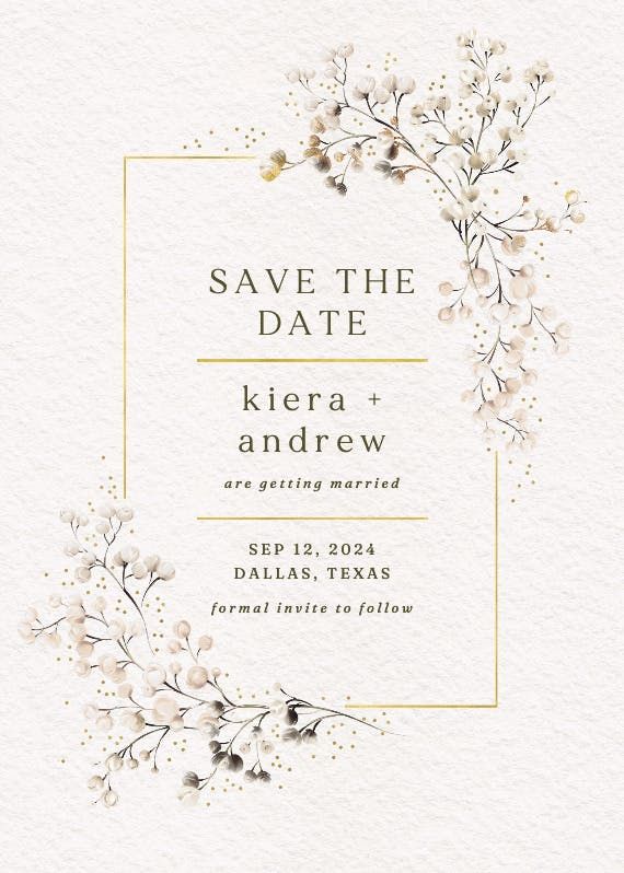 save the date card with white flowers and gold frame