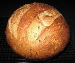 a loaf of bread sitting on top of a cooling rack