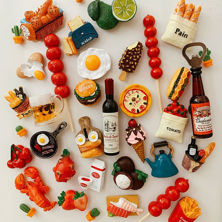 an assortment of miniature food items are arranged in the shape of a circle on a white surface