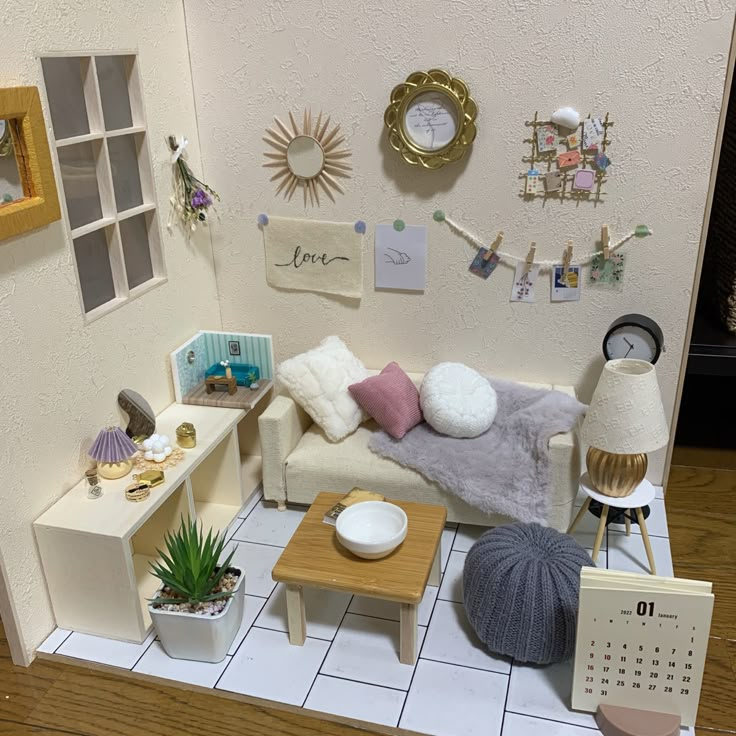 a dollhouse living room with furniture and decorations on the walls, including a couch