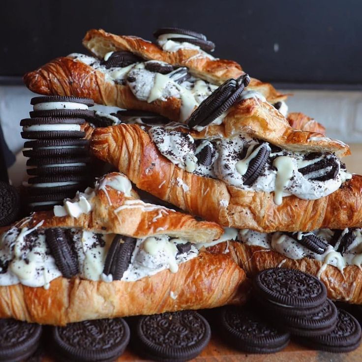 oreo cookies and cream are piled on top of croissants with oreos