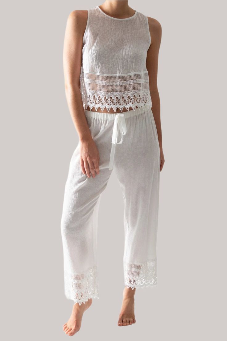 This is a photo of a woman wearing a white pair of pants with lace trim and matching white top with lace trim. The pants tie in the front. Gauze Pants, Crochet Lace Trim, Pants White, Cotton Crochet, Trim Color, Lounge Pants, Daybed, Pure White, Crochet Lace