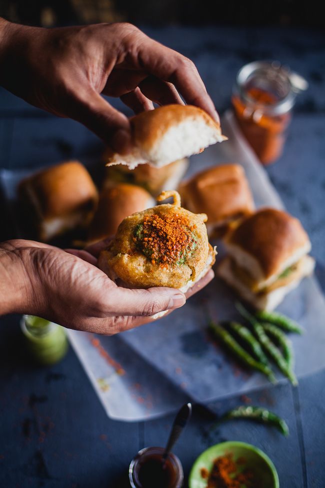 a person is holding some food in their hands