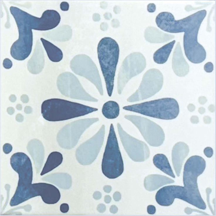 a blue and white tile design on the wall