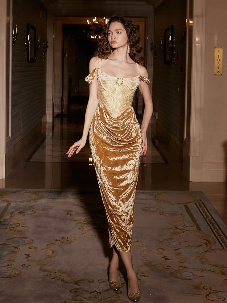 Maison Femalien Description:Indulge in timeless elegance with our Mustard Dream Victorian Dress. This captivating gown features a low neckline, lace-adorned bodice, and flowing A-line skirt, all bathed in a warm mustard hue reminiscent of golden fields. The dress is delicately embroidered with Victorian-inspired floral motifs, exuding a touch of nature's grace. With long, flowing sleeves and a cinched waist, this dress offers a perfect blend of simplicity and sophistication, making it an ideal c Golden Dress, Suspender Dress, Corset Dress, Fancy Dresses, Spring Dresses, Gorgeous Dresses, Pretty Dresses, Fashion Inspo Outfits, Beautiful Dresses