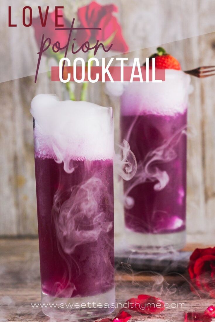 two tall glasses filled with liquid and ice on top of a table next to a red rose