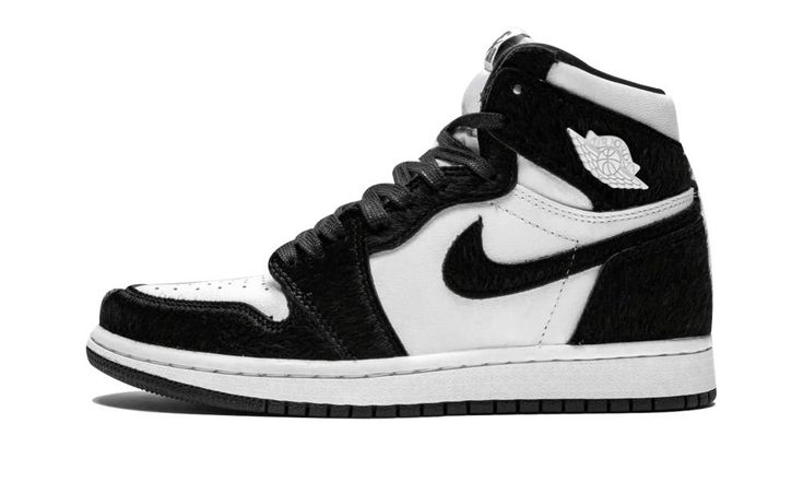 The women’s Air Jordan 1 “Panda” is a special edition of the iconic silhouette designed just for women. The unique construction of the classic Jordan 1 High features a white leather base with black faux fur panels. The clean two-tone look is reminiscent of the original black and white Air Jordan 1 colorway from 1985, with the furry construction putting a new twist on the OG look. The shoe is finished with metal Air Jordan “Wings” logos on each ankle in white. Each pair also comes with black and Air Jordan 1 Panda, Jordan 1 Panda, Womens Air Jordan 1, Womens Air Jordan, Wmns Air Jordan 1, Jordan 1 Black, Dr Shoes, Jordan Shoes Girls, Nike Air Shoes