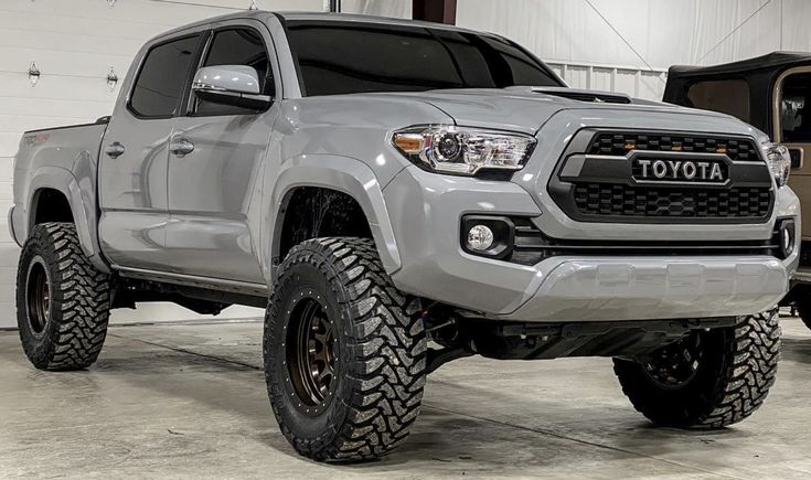 a gray toyota truck parked in a garage