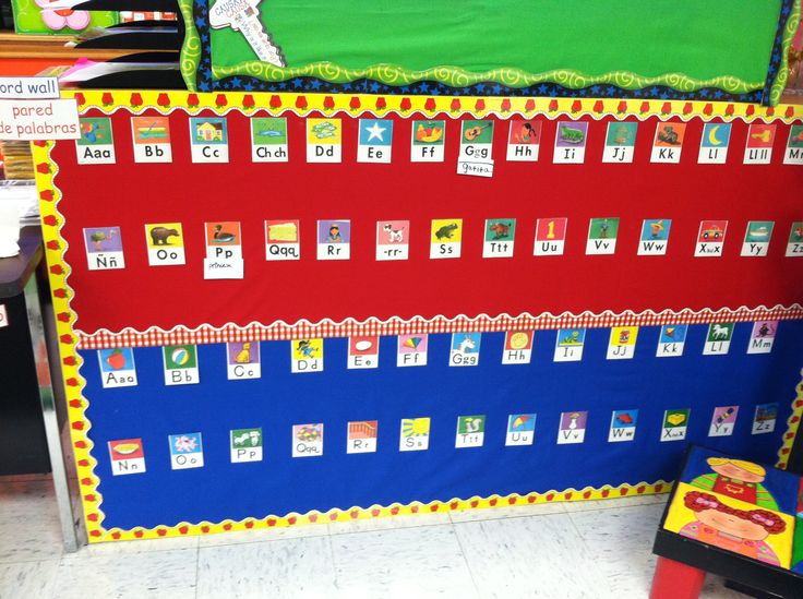 a bulletin board with numbers and pictures on it in a classroom setting for children to learn