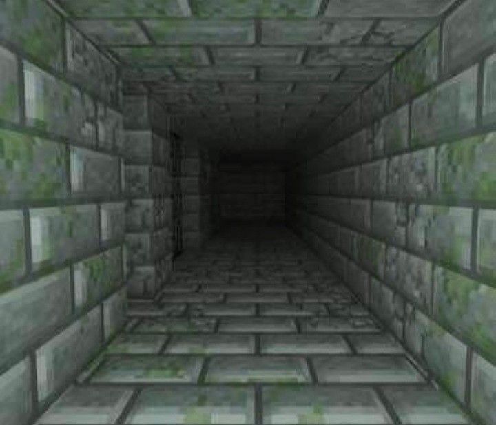 an image of a dark tunnel with green tiles on the floor and walls in it