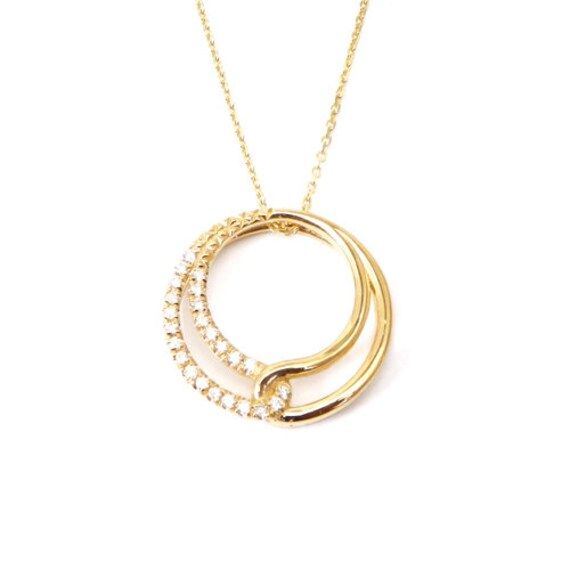 Round ladies pendant, made of yellow Gold and encrusted with small natural Diamonds. Can become an incredible gift to your lovely person. Big round pendant. Gemstone: Small Diamonds - 24 pcs. 0.20 carats Metal: Yellow Gold 14k Available metals: White Gold 14k Weight: 3.80 gram Catalog code: PH-6667 Condition: New Designer: Cohen Jewellers Free shipping 1-3 business days shipping Yellow Gold Diamond Cut Pendant Necklace, Exquisite Gold Necklace With Pave Setting, Fine Jewelry Yellow Gold Pendant Diamond Necklace, Fine Jewelry Yellow Gold Diamond Pendant Necklace, Exquisite Diamond Pendant Necklace With Pave Setting, Fine Jewelry Yellow Gold Diamond Necklace With Pave Setting, Exquisite Round Necklace With Pave Setting, Dazzling Gold Diamond Necklace With Round Pendant, Fine Jewelry Yellow Gold Diamond Necklace With Pavé Setting