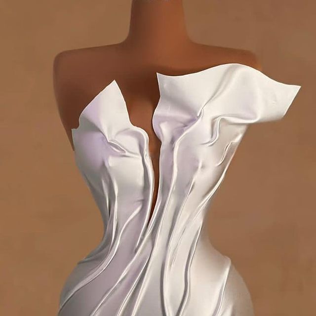 a mannequin with a white dress on it