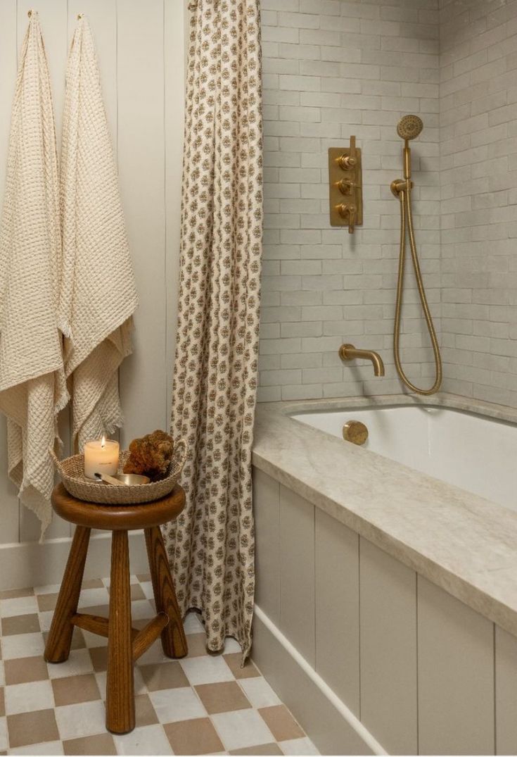 a bathroom with a checkered floor and white walls