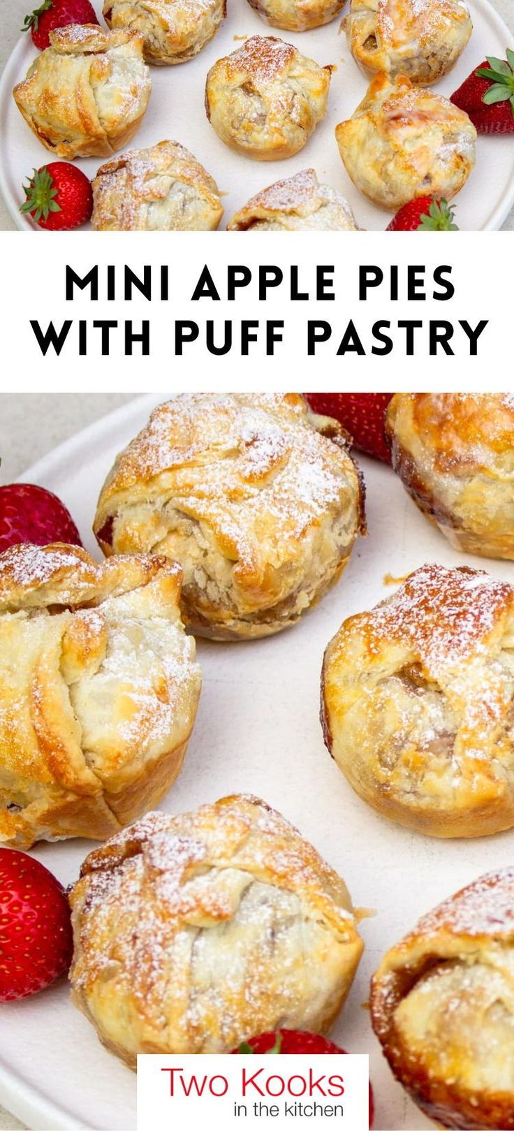 mini apple pies with puff pastry on a white platter and strawberries in the background