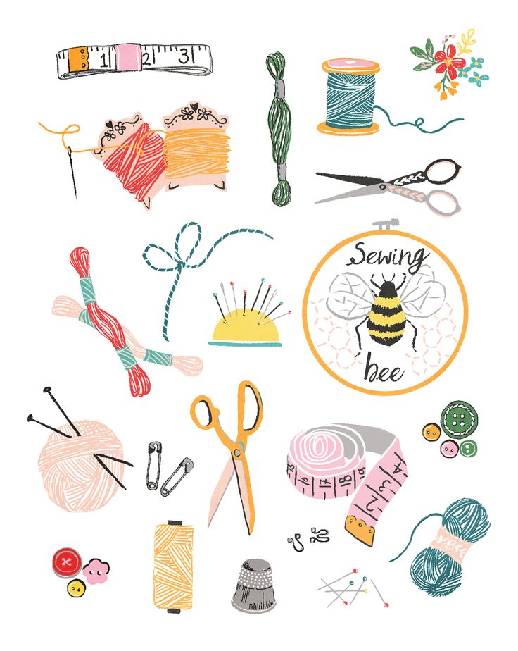 a bunch of different items that are on a white surface, including yarn and scissors