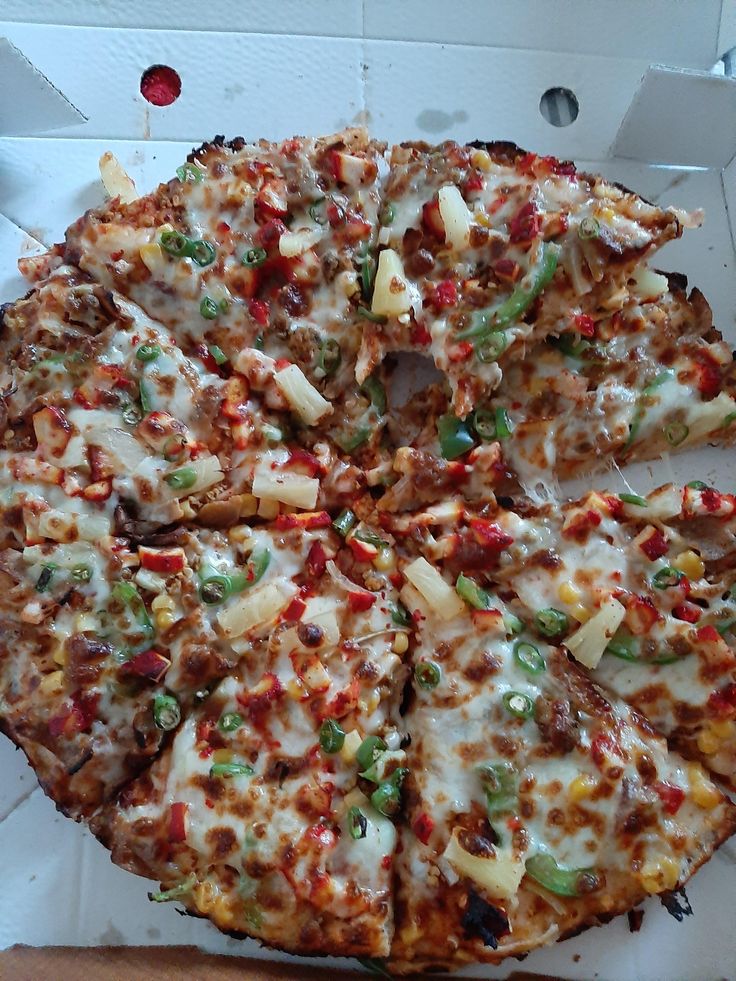 the pizza is cut into eight pieces and ready to be eaten with toppings on it