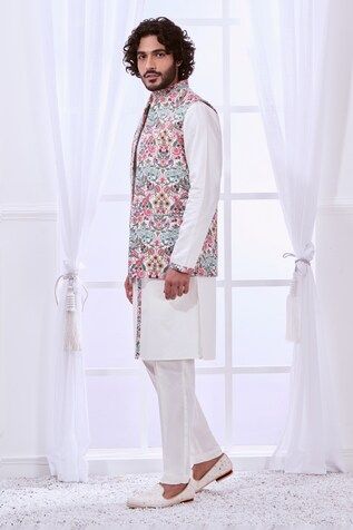 White Nehru jacket with thread embroidery in floral pattern. - Aza Fashions White Sleeveless Nehru Jacket With Resham Embroidery, Traditional Floral Print Bandhgala For Spring, Traditional Spring Bandhgala With Floral Print, Spring Wedding Cotton Sherwani, White Sleeveless Cotton Nehru Jacket, White Sherwani With Chikankari Embroidery For Spring, Spring White Sherwani With Chikankari Embroidery, Spring White Nehru Jacket With Floral Print, Spring Cotton Bandhgala With Resham Embroidery