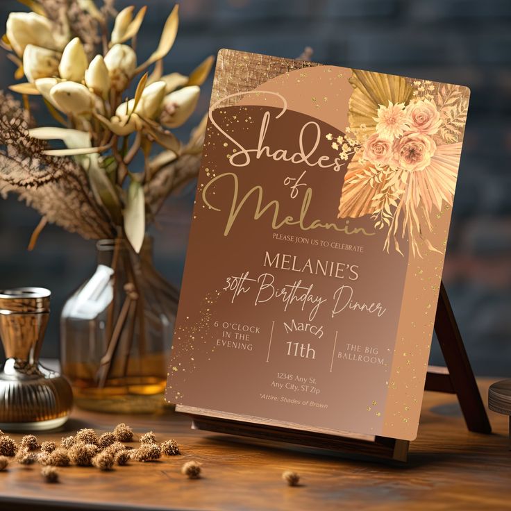 a table topped with a menu next to a vase filled with flowers and other items